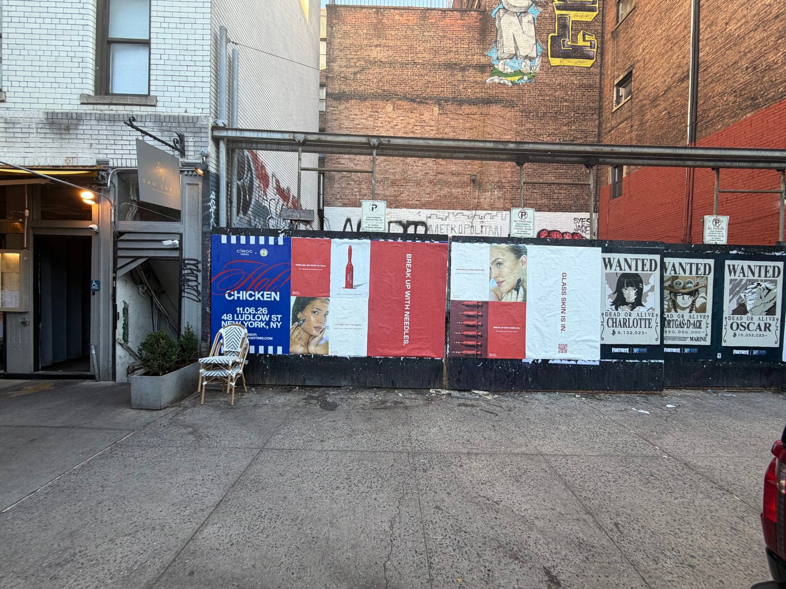 Beyond Miracles red and cream skincare posters installed on a street-facing wall by Visual Street Ads
