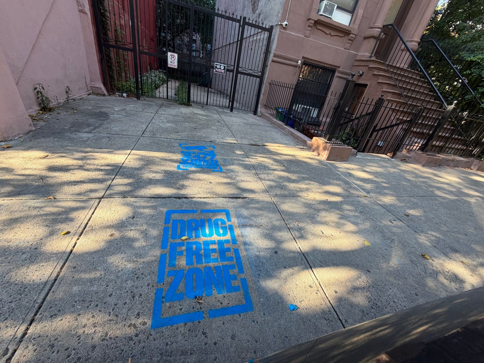 Sidewalk stencil placement for a community awareness campaign in Harlem