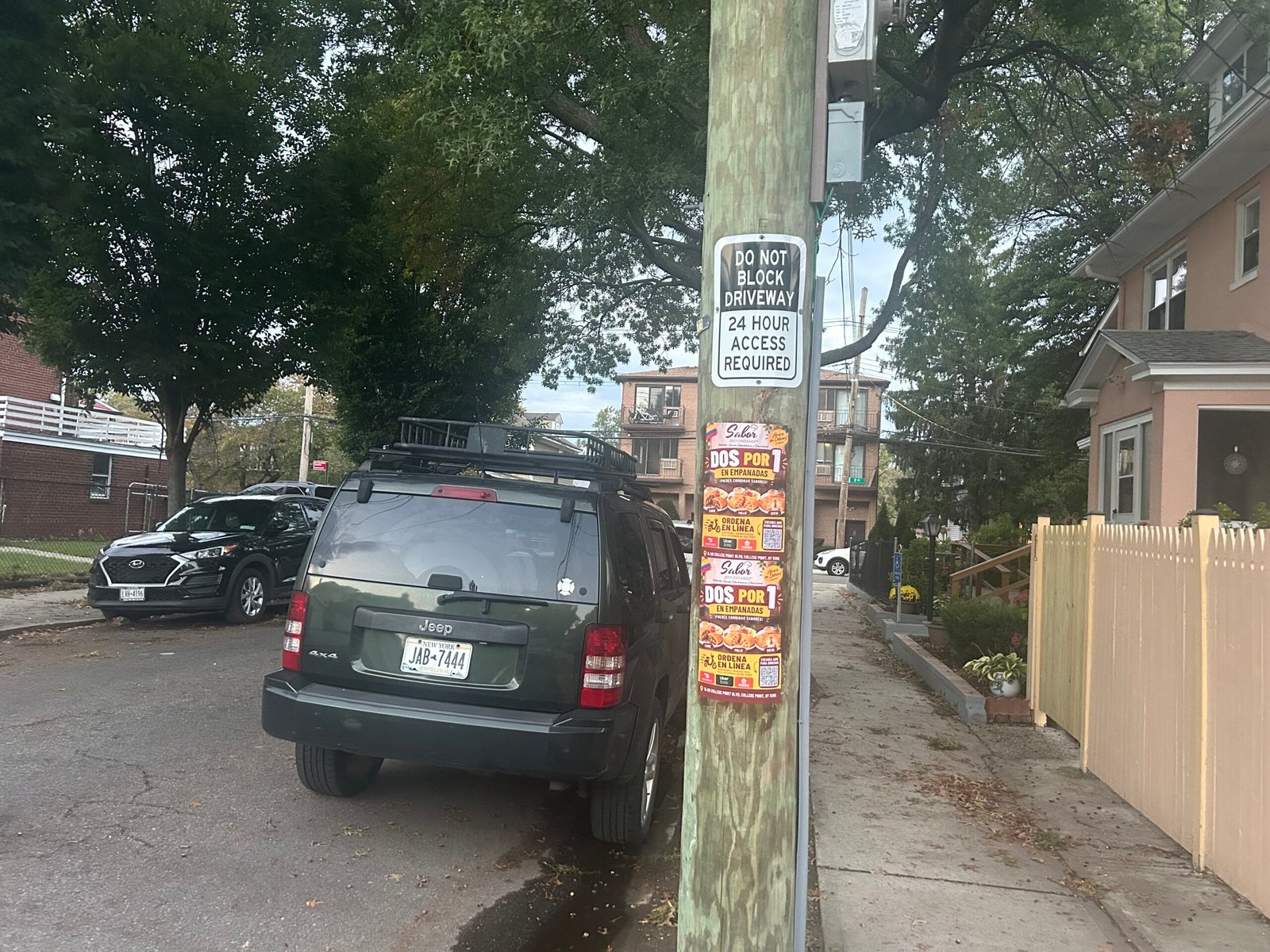 Near 9-03 118th Street, College Point — paired 11×17 wheatpasted posters.