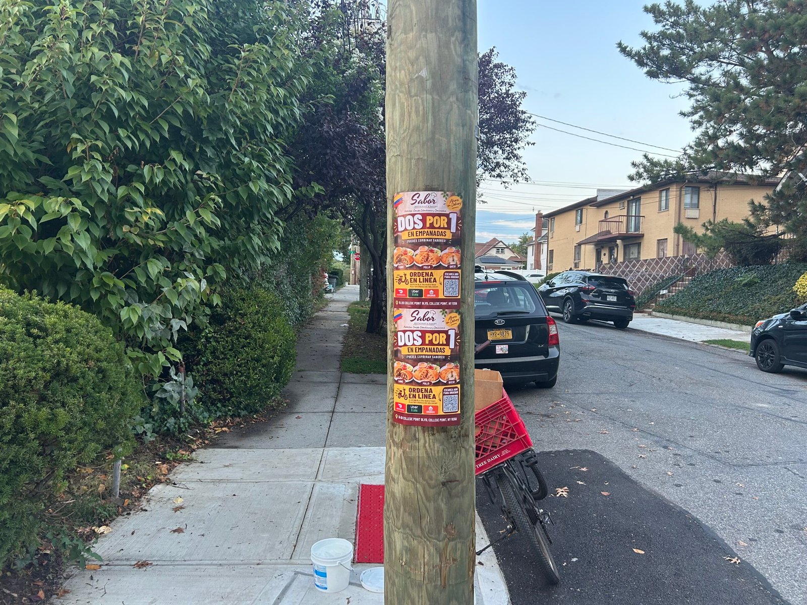 Sabor 11×17 wheatpasted posters on a street pole along 117th Street, College Point, Queens